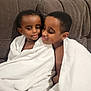 child, children, towel, white_towel, couch, brown_couch, indoor, portrait, smile, affection, siblings, close, wrapped, cozy, cute, happy, toddler, young, family, love