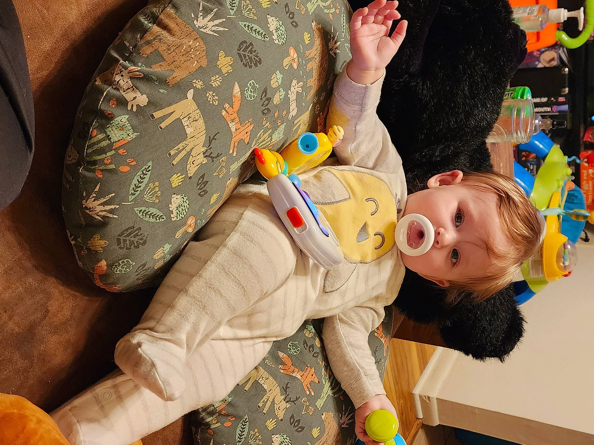 Aria is registered to the contest to win money with this photo: baby, baby_products, baby_toys, child, comfort, elbow, fun, happy, leisure, pattern, person, play, room, sitting, sleeve, stuffed_toy, textile, toddler, toy