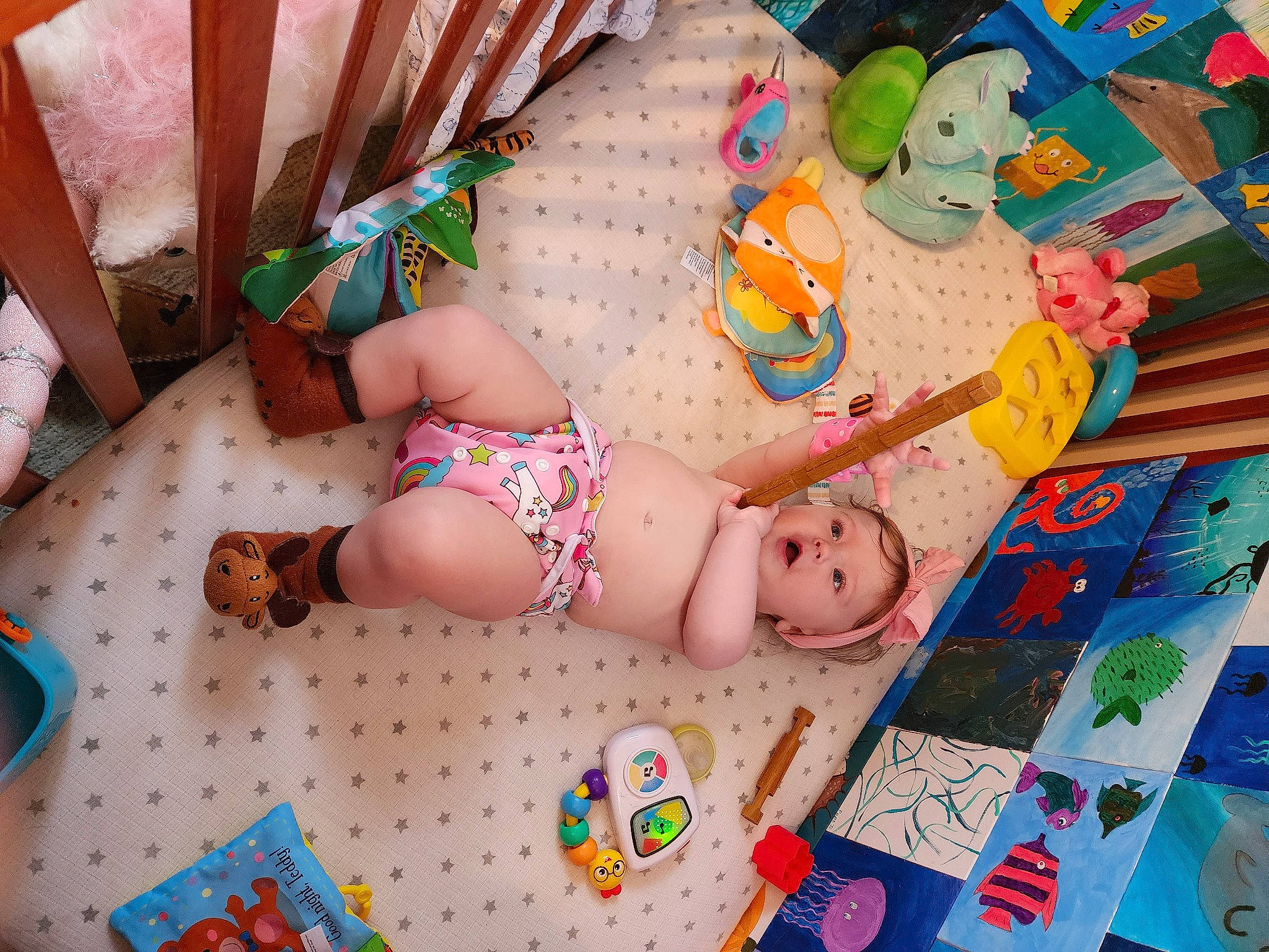 Aria is registered to the contest to win money with this photo: baby, baby_products, baby_toddler_clothing, child, flooring, foot, fun, human_body, human_leg, leg, pattern, person, pink, play, product, room, sock, textile, thigh, toddler