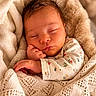 baby, blanket, closeup, clothing, comfort, cozy, cute, face, hand, indoors, infant, newborn, patterned, peaceful, portrait, resting, skin, sleeping, soft, warm