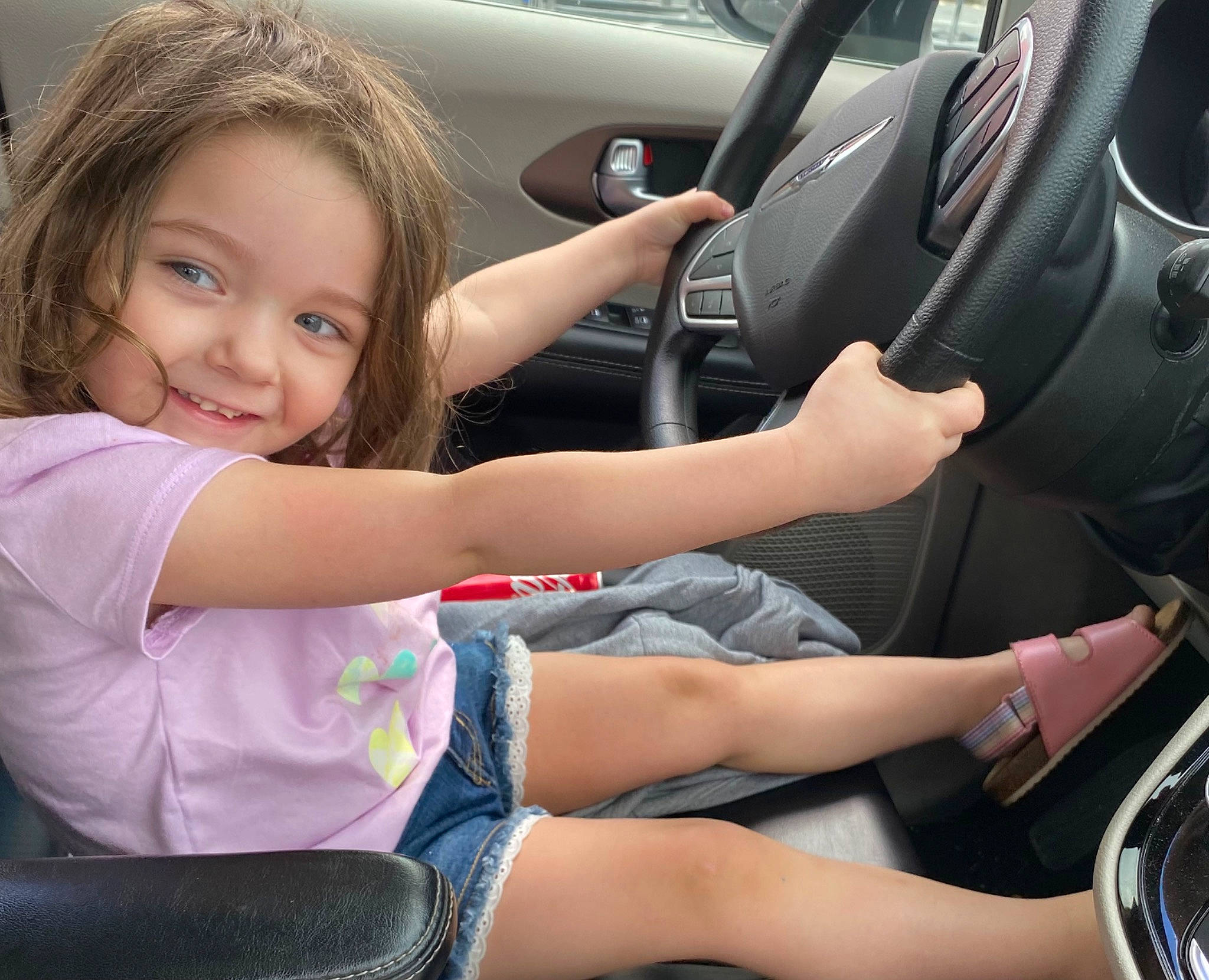 Aria is registered to the contest to win money with this photo: arm, automotive_design, automotive_exterior, car, car_seat, car_seat_cover, finger, hand, head_restraint, joy, leg, motor_vehicle, muscle, person, personal_luxury_car, shorts, smile, steering_part, steering_wheel, thigh