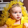 Allysson is registered to the contest to win money with this photo: baby, child, tiara, yellow_dress, tulle, portrait, blue_eyes, cute, infant, face, dress, headwear, costume, adorable, soft_lighting, indoor, fashion, young_child, person, closeup