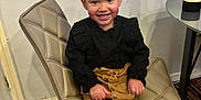 Carly-Rae joined the competition — help win amazing prizes! child, girl, smiling, braided_hair, bows, black_top, mustard_tights, black_boots, chair, indoor, floor, table, carpet, happy, portrait, person, seated, fashion, cute, young