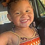 child, smiling, braided_hair, hair_bows, tank_top, colorful_clothing, car_interior, seat, window, sunlight, necklace, happy, portrait, cute, young_child, beads, casual, indoors, person, fashion