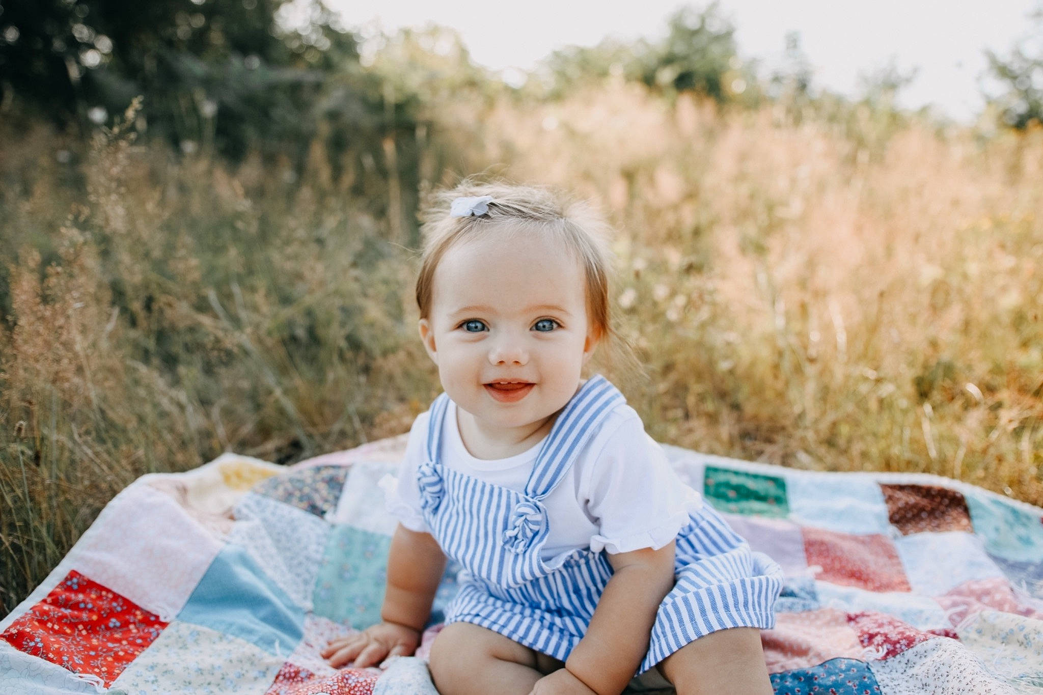 Marley Jo is registered to the contest to win money with this photo: baby, child, grass, joy, pattern, people, person, photograph, photography, picnic, portrait, portrait_photography, recreation, sitting, smile, summer, toddler, vacation