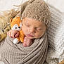 Sacha participe au concours pour gagner de l'argent avec cette photo : baby, basket, blanket, child, cozy, crocheted_toy, cute, face, fox_toy, hand, indoors, infant, knit_hat, newborn, peaceful, resting, sleeping, soft_texture, swaddled, warm_colors