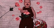 Remi joined the competition — help win amazing prizes! baby, blanket, bouquet, celebration, clothing, cute, flower, happy, infant, lying_down, nature, person, pink, portrait, red, rose, rose_petals, smiling, soft_texture, toddler