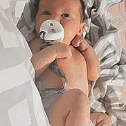Booker is registered to the contest to win money with this photo: baby, baby_safety, baby_sleeping, baby_toddler_clothing, cheek, comfort, eye, eyelash, gesture, happy, head, linens, neck, nose, skin, smile, stomach, thumb, toddler, trunk