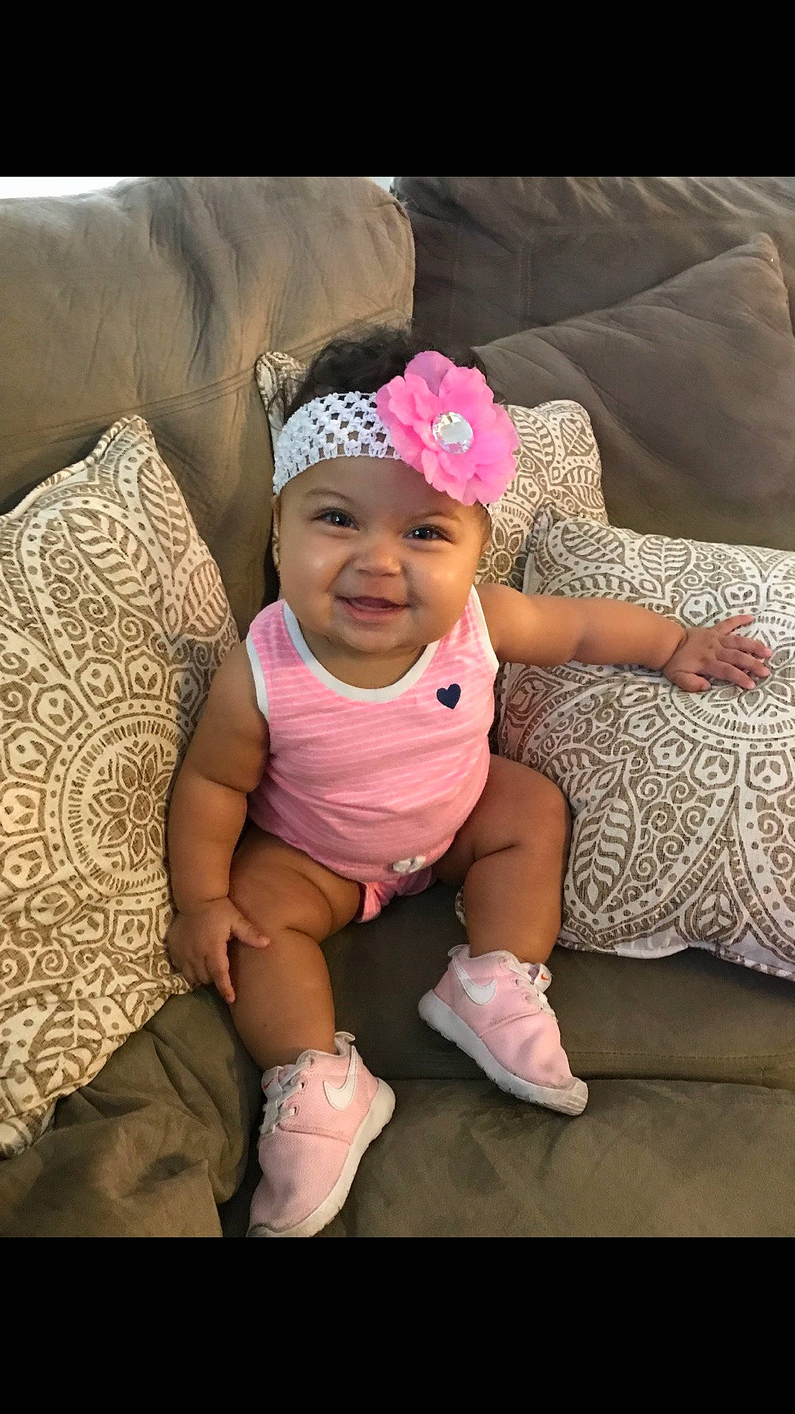 Blaikley is registered to the contest to win money with this photo: abdomen, child, day, eye, finger, fun, girl, hair_accessory, happiness, headband, headgear, headwear, human, infant, joy, person, pink, product, sitting, skin