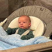 Ezra joined the competition — help win amazing prizes! baby, infant, newborn, bouncer, blanket, blue_blanket, pacifier, seat, harness, onesie, sleeve, face, head, eyes, cheeks, indoor, home, soft, baby_boy, relaxed