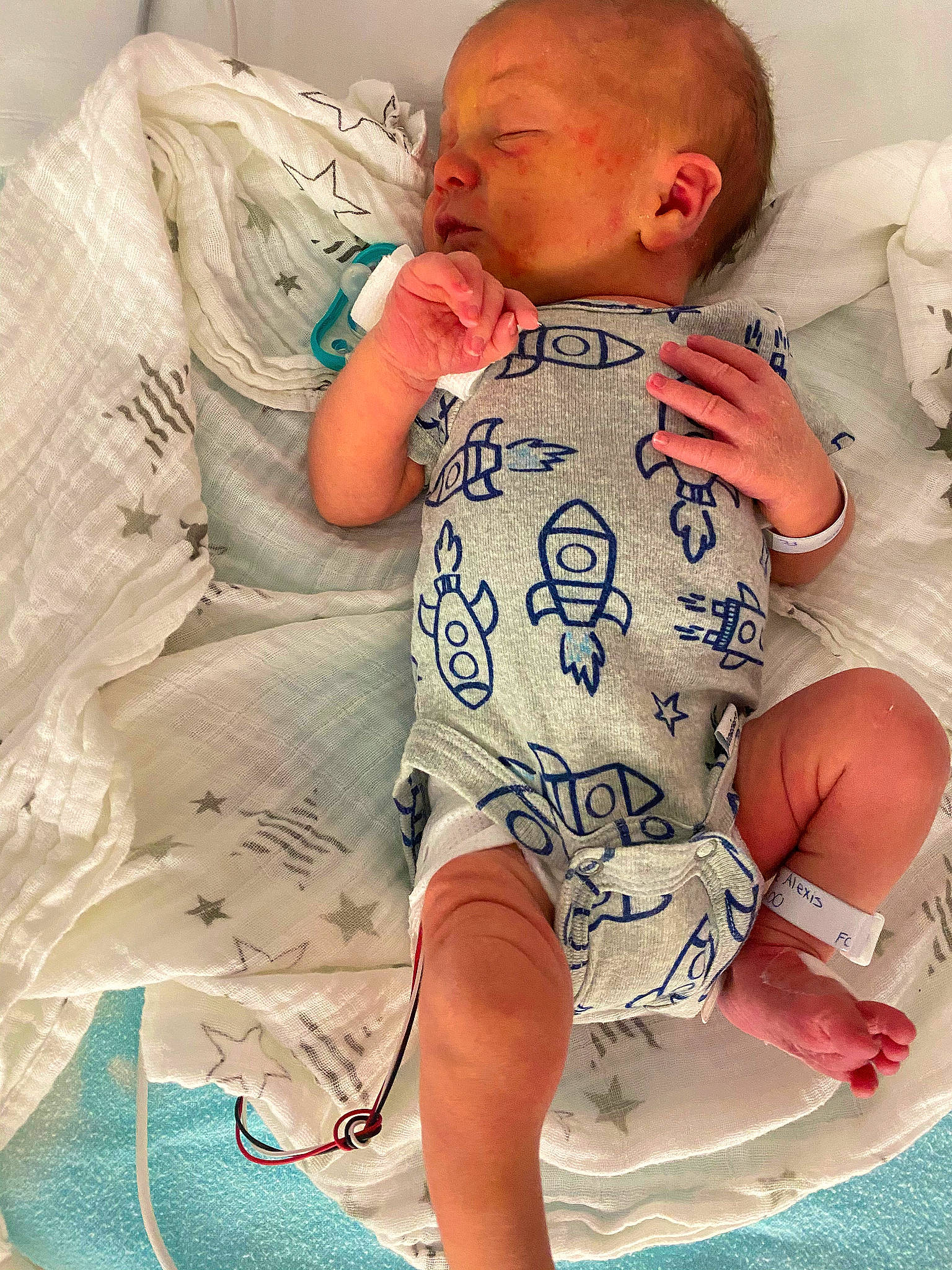 Samuel is registered to the contest to win money with this photo: abdomen, baby, baby_sleeping, baby_toddler_clothing, child, comfort, cool, happy, head, human_leg, joint, knee, leg, person, sitting, skin, sleeve, stomach, textile, thigh