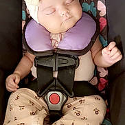 Alessandra joined the competition — help win amazing prizes! baby, sleeping, headband, bow, car_seat, neck_pillow, pajamas, footwear_free, infant, child, patterned, butterfly, floral, colorful, cute, peaceful, portrait, indoors, resting, soft