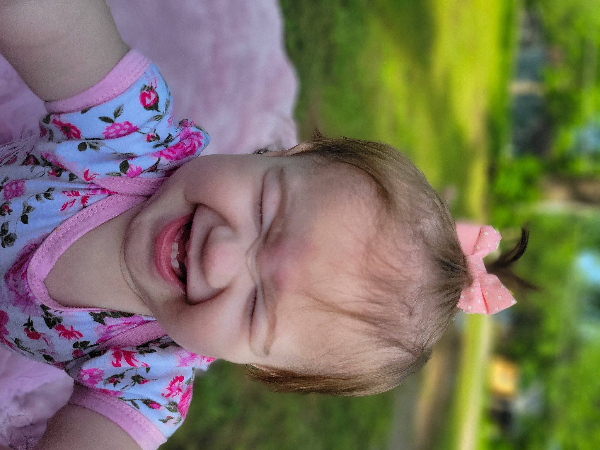 Ada is registered to the contest to win money with this photo: baby, beauty, eye, fun, gesture, grass, hand, happy, leisure, lip, neck, nose, people_in_nature, person, pink, plant, skin, smile, toddler, tree