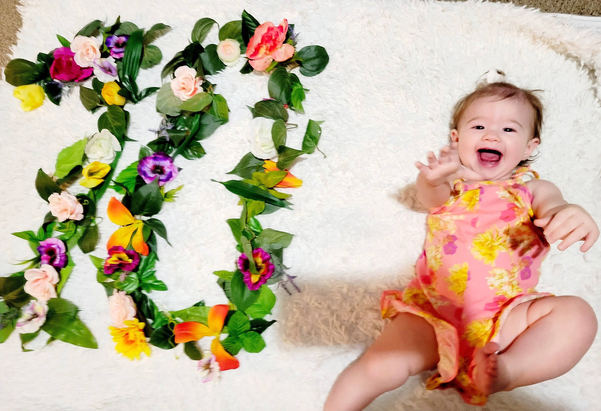 Ada joined the competition — help win amazing prizes! artificial_flower, baby_toddler_clothing, bouquet, cut_flowers, day_dress, dress, flower, flower_arranging, flowering_plant, grass, happy, magenta, pattern, person, petal, plant, sleeve, smile, textile, toddler