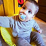 Loüka a rejoint le concours — aidez-le/la à gagner de superbes lots ! toddler, child, pacifier, yellow_chair, indoor, curious, baby, seated, clothing, long_sleeve, pants, face, eyes, hair, wood_floor, furniture, cozy, warm_lighting, portrait, cute