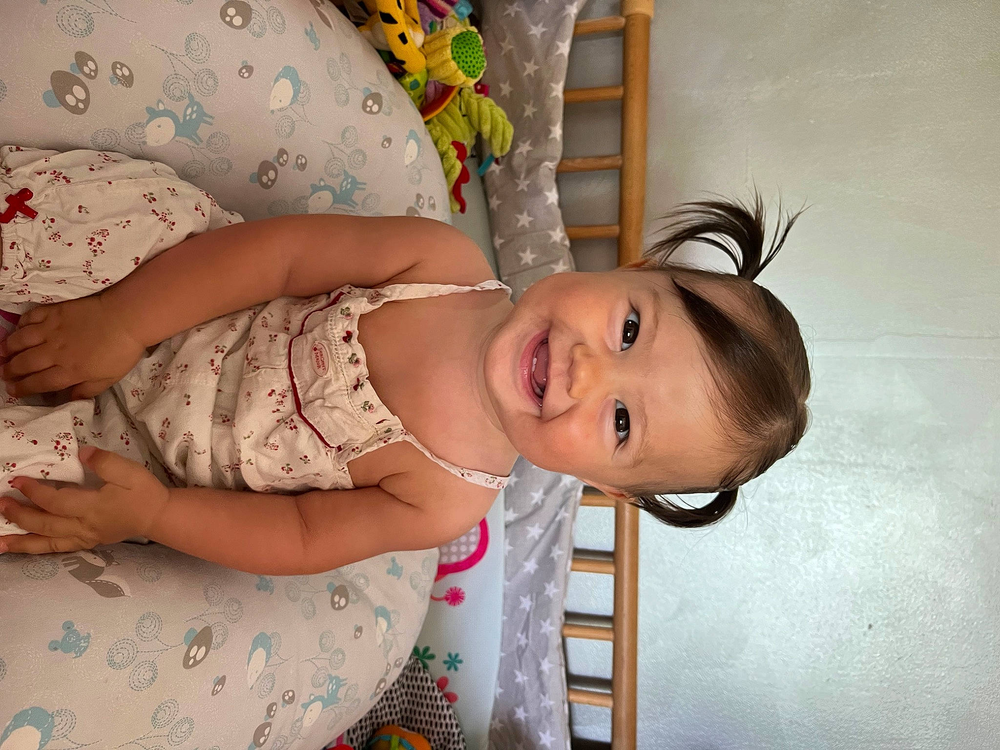 Liyana participe au concours pour gagner de l'argent avec cette photo : abdomen, arm, baby, baby_products, baby_toddler_clothing, cheek, child, day_dress, dress, eyelash, finger, fun, happy, human_body, iris, joy, pattern, person, room, skin