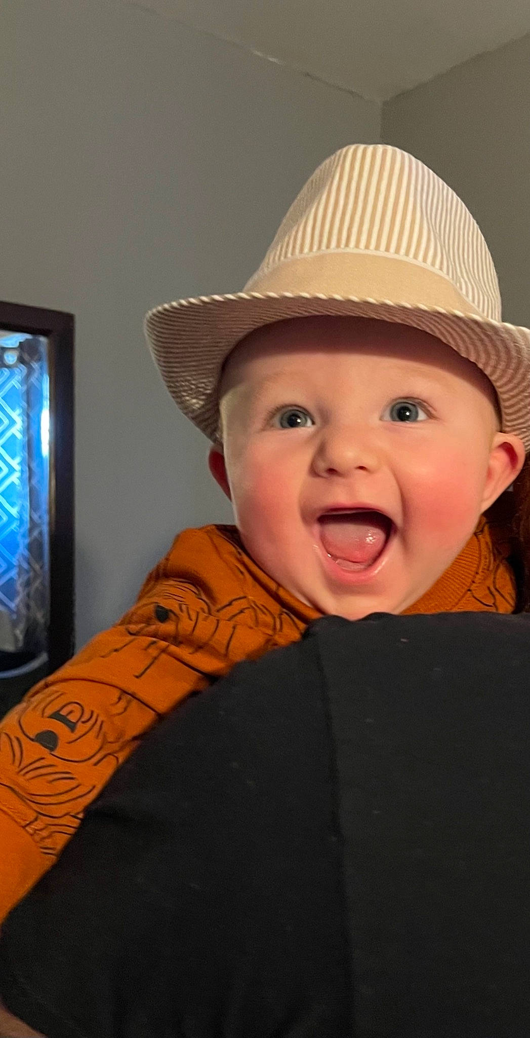 Mikey is registered to the contest to win money with this photo: baby, cheek, chin, eye, face, facial_expression, flash_photography, hair, happy, hat, headgear, headwear, jaw, lip, mammal, nose, person, skin, sleeve, smile