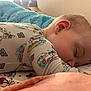 Myles is registered to the contest to win money with this photo: baby, sleeping, pajamas, dog_print, blanket, bed, child, cute, face, ear, soft, comfort, rest, peaceful, indoor, clothing, pattern, infant, closeup, cozy
