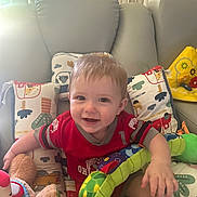 Elliot joined the competition — help win amazing prizes! architecture, baby, building, chair, clothing, couch, cushion, face, furniture, head, homedecor, indoors, livingroom, person, photography, portrait, room, sitting, t_shirt, toy