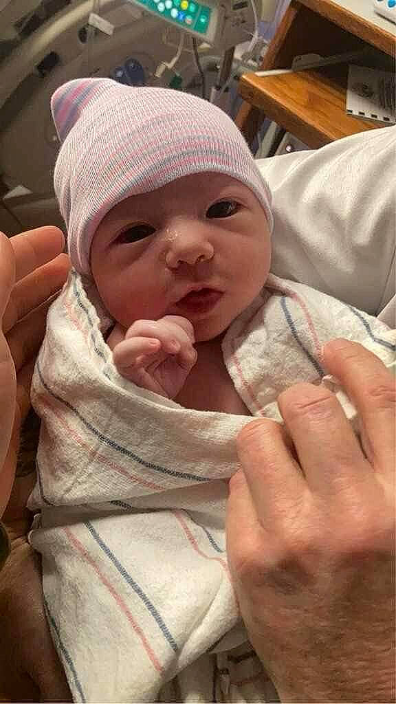 Evelyn joined the competition — help win amazing prizes! baby, baby_products, baby_toddler_clothing, cap, cheek, child, comfort, eyelash, finger, gesture, hand, hat, headwear, linens, lip, mouth, nail, person, skin, thumb