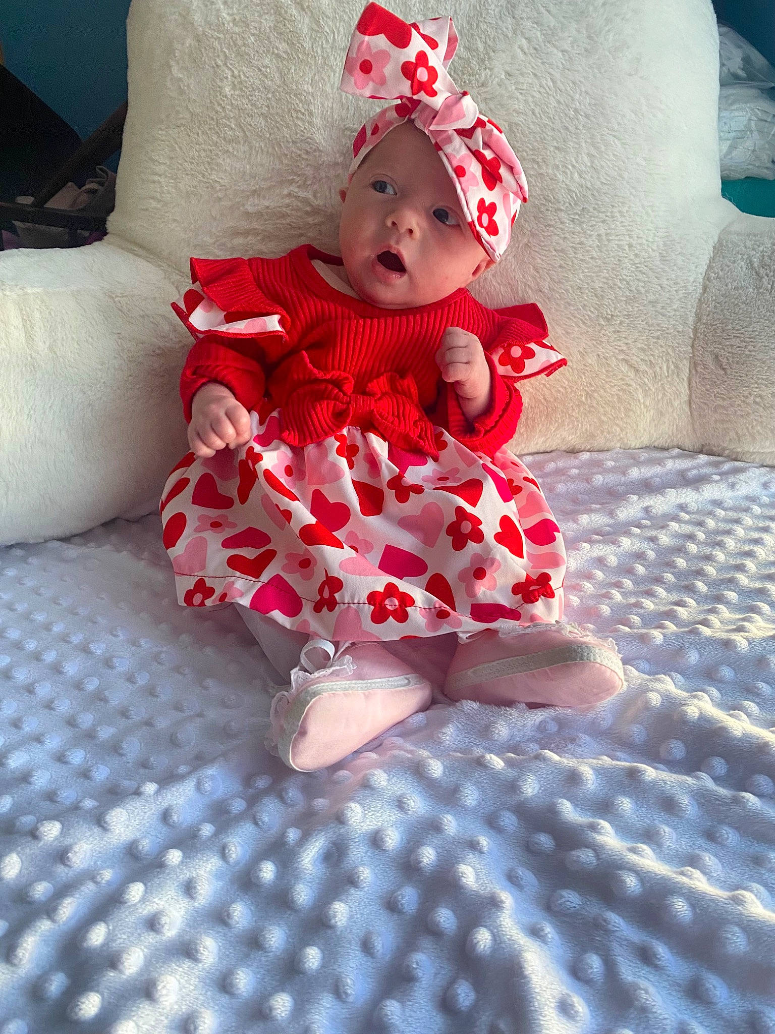 Evelyn joined the competition — help win amazing prizes! baby, baby_toddler_clothing, carmine, child, comfort, costume_hat, day_dress, dress, face, fashion_accessory, flooring, fun, happy, headwear, human_leg, magenta, pattern, person, sitting, sleeve