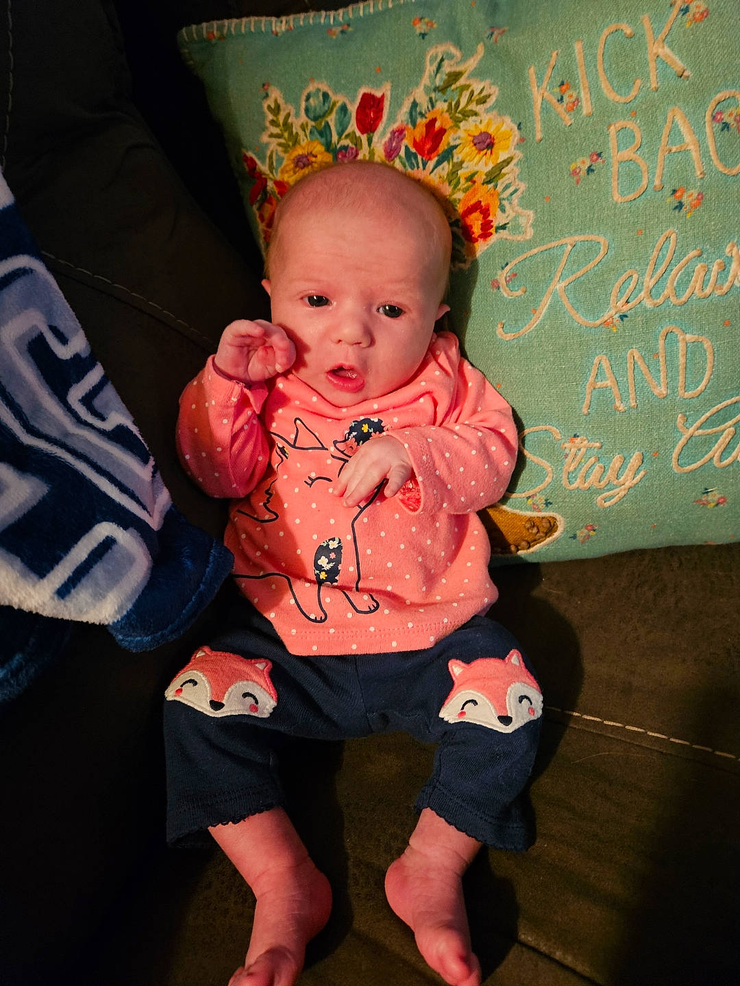 Evelyn is registered to the contest to win money with this photo: baby, baby_toddler_clothing, barefoot, cheek, child, event, eye, flash_photography, flooring, foot, fun, handwriting, happy, holiday, human_leg, person, pink, room, sitting, sock