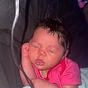 Amora is registered to the contest to win money with this photo: newborn, baby, sleeping, infant, pink_clothing, blanket, closeup, indoor, peaceful, face, hand, soft_texture, cozy, portrait, child, young, resting, human, cute, warm_light