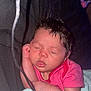 newborn, baby, sleeping, infant, pink_clothing, blanket, closeup, indoor, peaceful, face, hand, soft_texture, cozy, portrait, child, young, resting, human, cute, warm_light