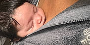 Amora is registered to the contest to win money with this photo: baby, sleeping, face, hair, person, skin, fleece, clothing, zipper, chest, closeup, indoor, warm, wood, texture, cozy, snuggle, soft, portrait, calm