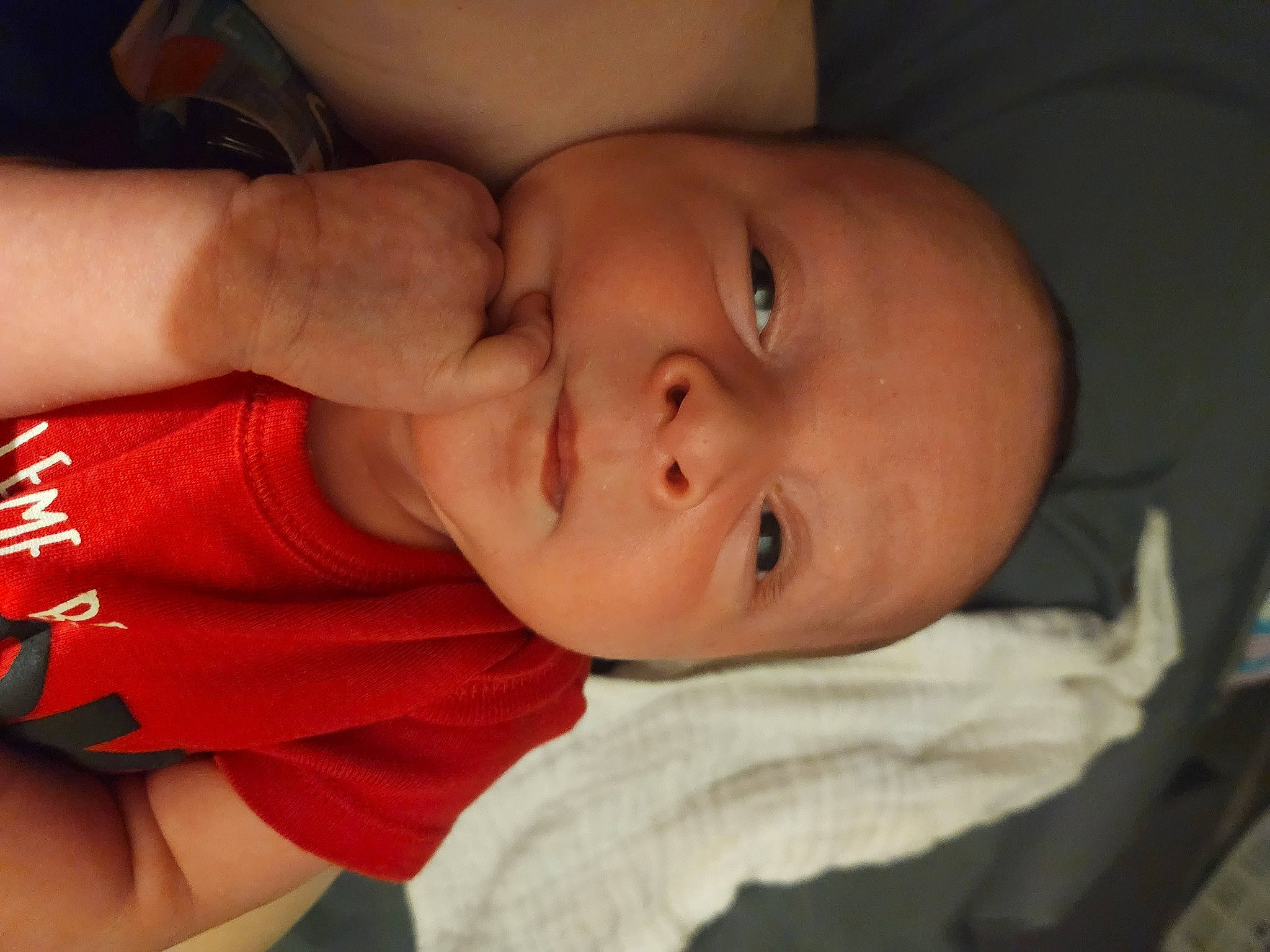 Cayden is registered to the contest to win money with this photo: baby, baby_toddler_clothing, cheek, chin, comfort, elbow, eyebrow, finger, forehead, gesture, human_body, iris, lip, mouth, neck, nose, person, skin, sleeve, smile