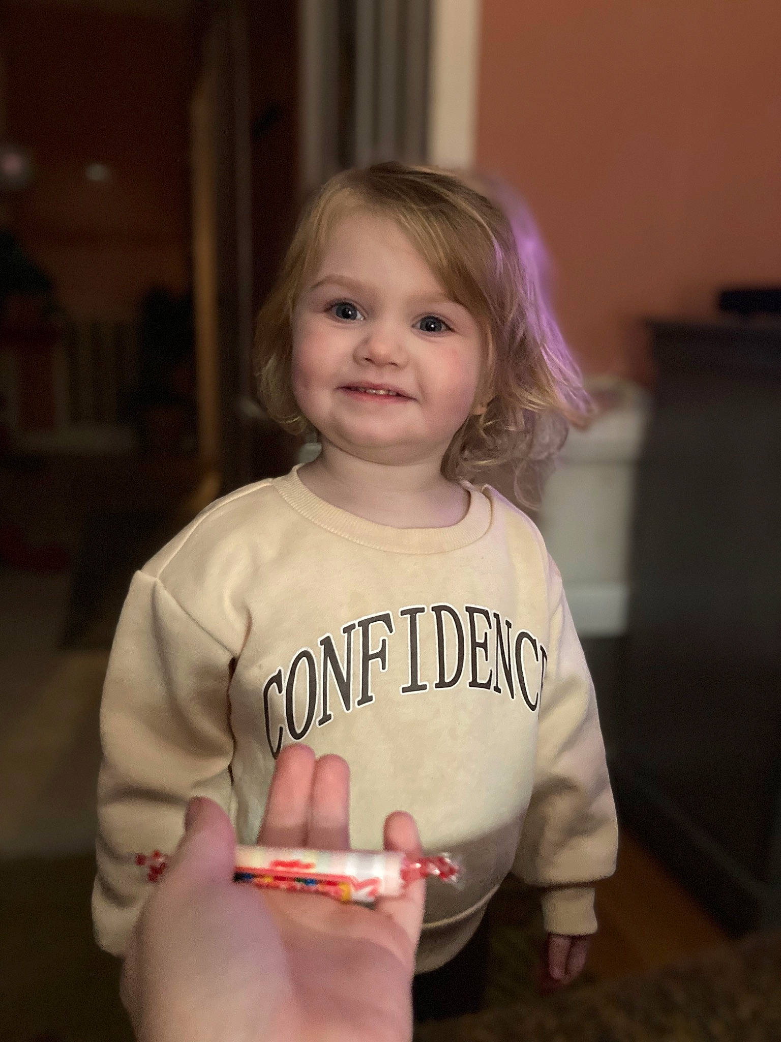 Annlee joined the competition — help win amazing prizes! baby_toddler_clothing, cheek, child, elbow, eye, face, flooring, fun, gadget, gesture, happy, joy, lip, nail, person, sitting, skin, sleeve, smile, standing
