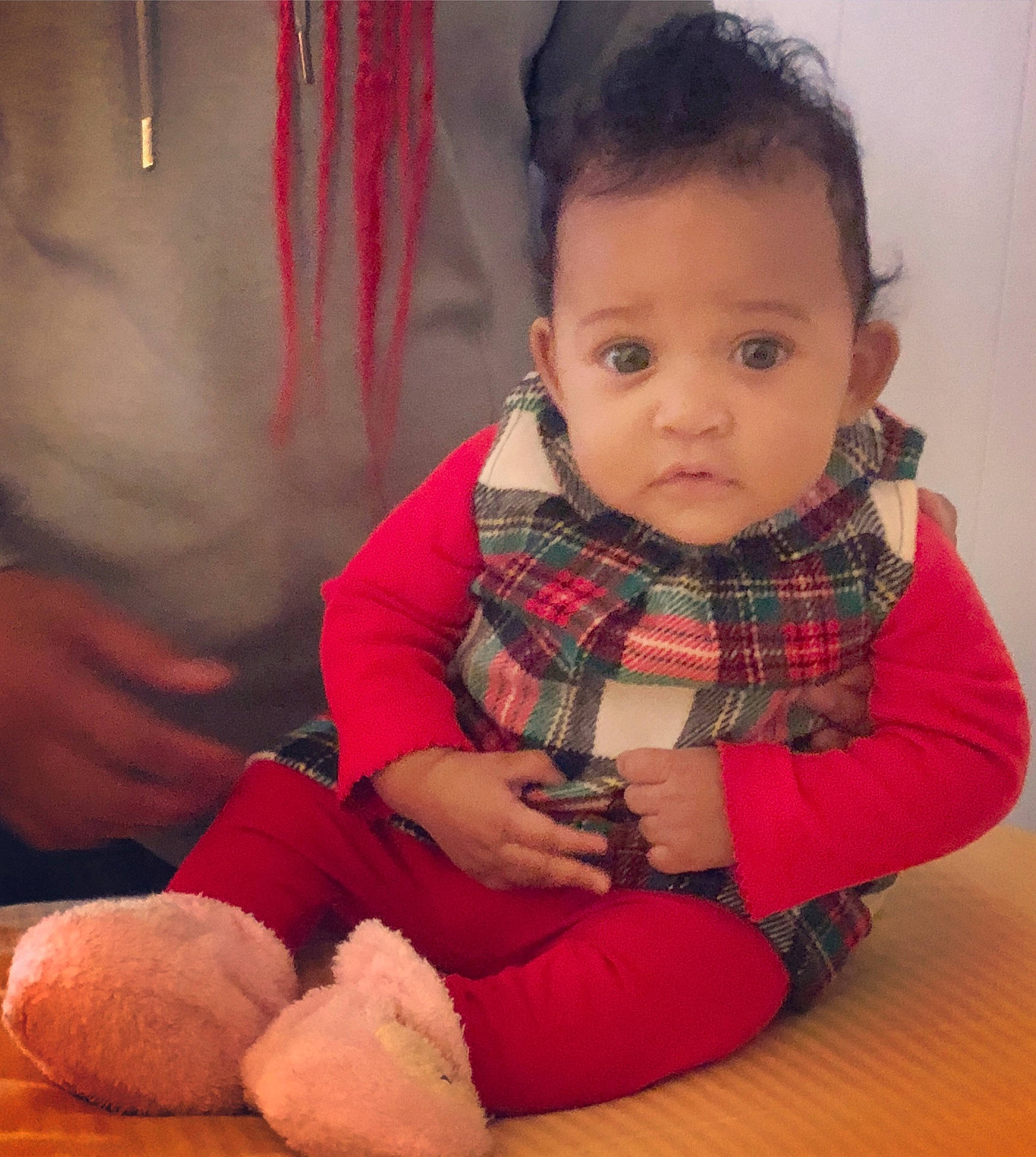 Aminah is registered to the contest to win money with this photo: cheek, child, girl, infant, person, plaid, product, sitting, skin, toddler