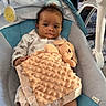 Jayce is registered to the contest to win money with this photo: baby, infant, child, portrait, bouncer, baby_seat, stuffed_animal, blanket, plush_toy, smiling, wide_eyes, indoors, nursery, seated, lying_down, baby_gear, soft_blanket, feet, home, cozy