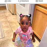 Zaneshia joined the competition — help win amazing prizes! appliance, birthday, cabinet, celebration, child, curious, girl, hair_buns, indoor, kitchen, looking_up, person, pink_shirt, portrait, screenshot, social_media, text_overlay, tile_floor, toddler, tutu