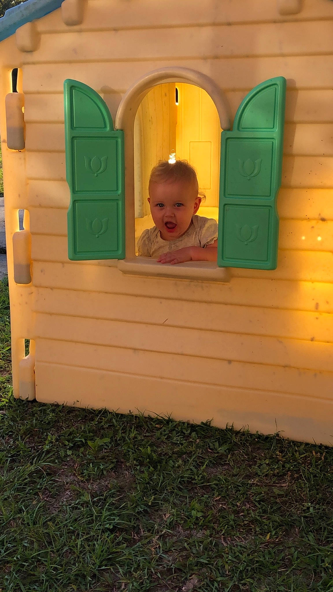 Kaylie joined the competition — help win amazing prizes! child, door, grass, green, person, toddler, wood, yellow
