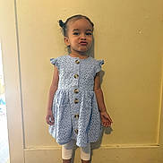 Arabella joined the competition — help win amazing prizes! child, girl, toddler, portrait, standing, indoors, dress, blue_dress, hair_bows, braids, leggings, sandals, duck_face, playful, yellow_wall, wood_floor, toy, toy_vacuum, doorway, full_body