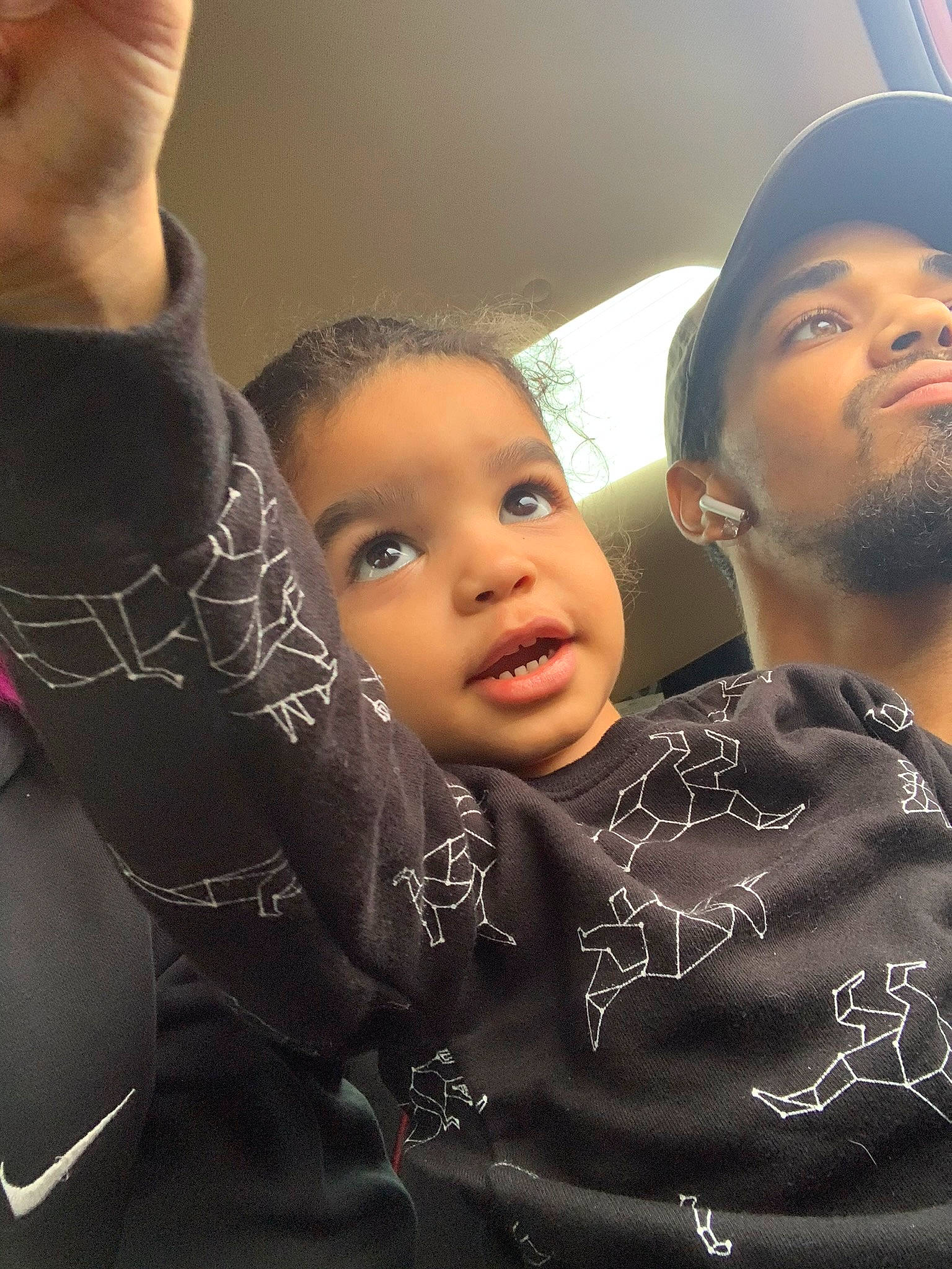 Hasani is registered to the contest to win money with this photo: baby, baseball_cap, beard, car_seat, child, eye, flash_photography, fun, gesture, hairstyle, happy, hat, jewellery, organ, pattern, person, selfie, skin, smile, temporary_tattoo