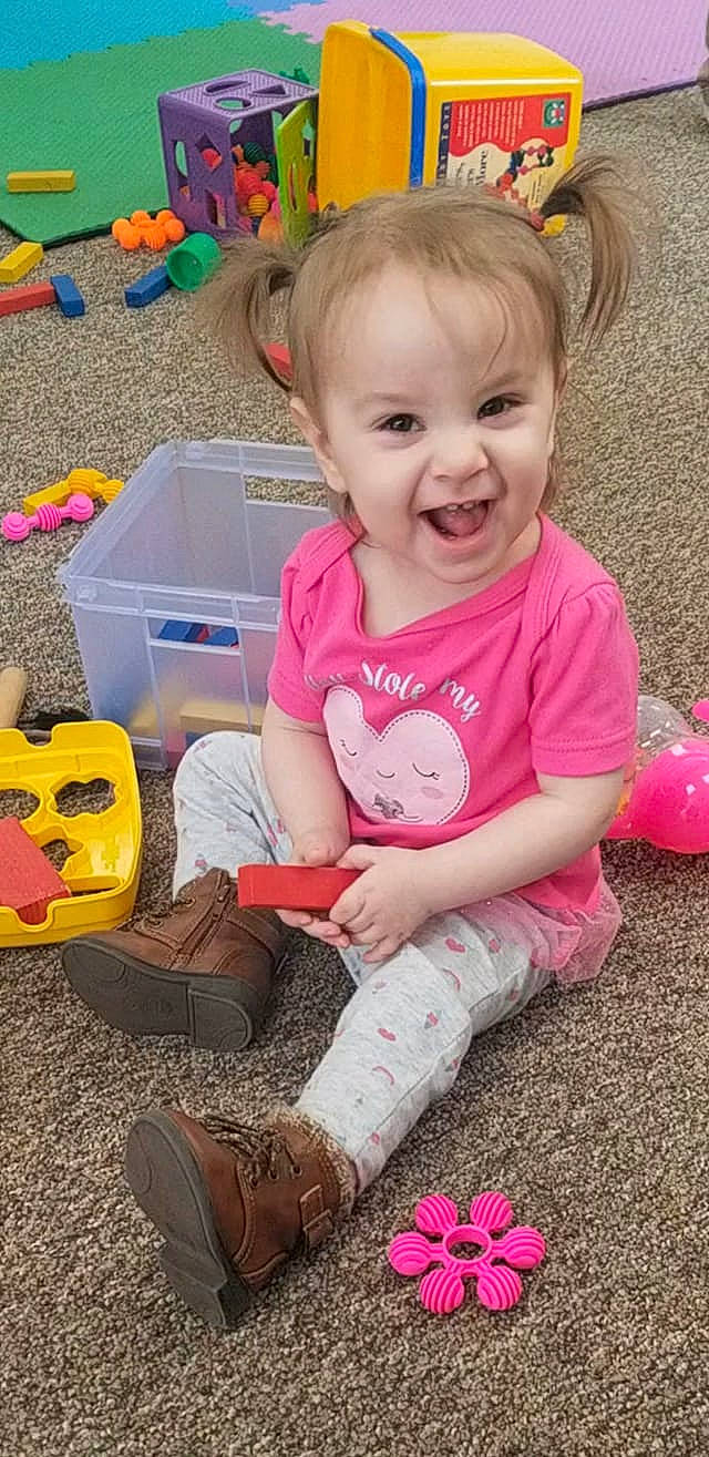 Cambria joined the competition — help win amazing prizes! baby, baby_playing_with_toys, baby_toddler_clothing, cheek, child, leg, person, pink, play, room, sitting, toddler, toy