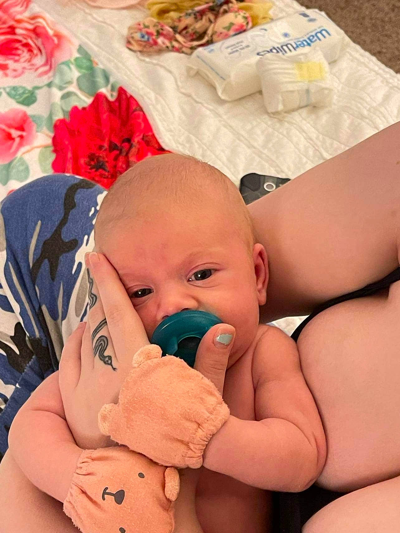 Constance is registered to the contest to win money with this photo: arm, baby, cheek, comfort, eye, finger, gesture, hand, happy, head, human_body, leg, mouth, nose, person, pink, product, skin, textile, thumb