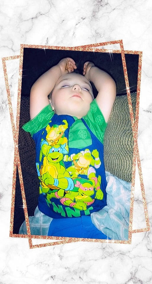 Landon is registered to the contest to win money with this photo: baby, baby_products, cheek, child, pattern, person, picture_frame, product, textile, toddler