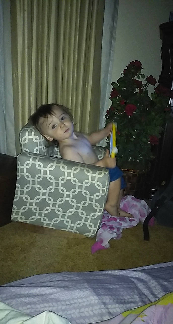 Landon is registered to the contest to win money with this photo: child, fun, lap, leg, person, sitting