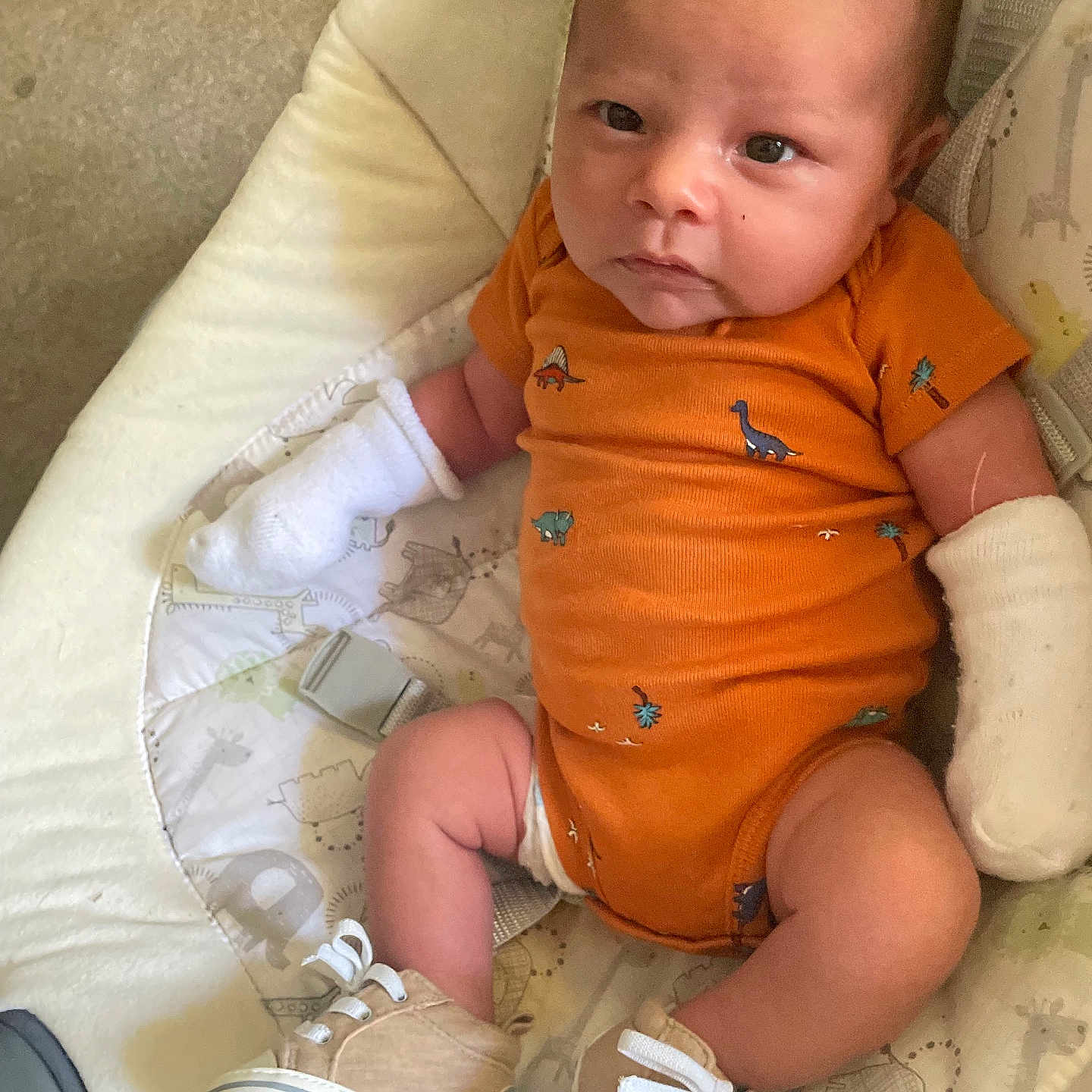 M.j is registered to the contest to win money with this photo: baby, clothing, couch, cushion, diaper, face, footwear, furniture, head, homedecor, hosiery, newborn, person, photography, portrait, shoe, sitting, sleeve, sneaker, sock