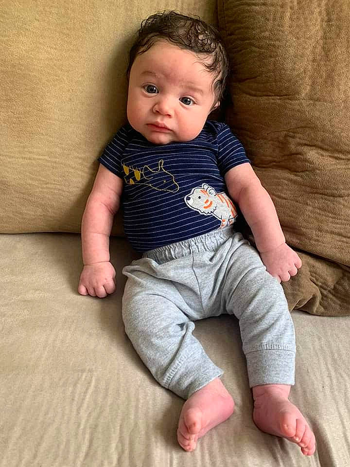 Aj is registered to the contest to win money with this photo: baby, baby_toddler_clothing, cheek, child, child_model, face, leg, person, sitting, skin, sleeve, toddler