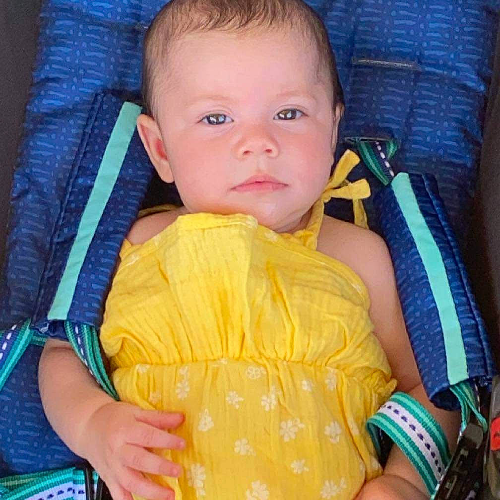 Avianna is registered to the contest to win money with this photo: azure, baby, baby_carriage, baby_products, baby_toddler_clothing, chair, cheek, child, comfort, electric_blue, eye, finger, happy, head, nose, person, product, sitting, sleeve, thumb