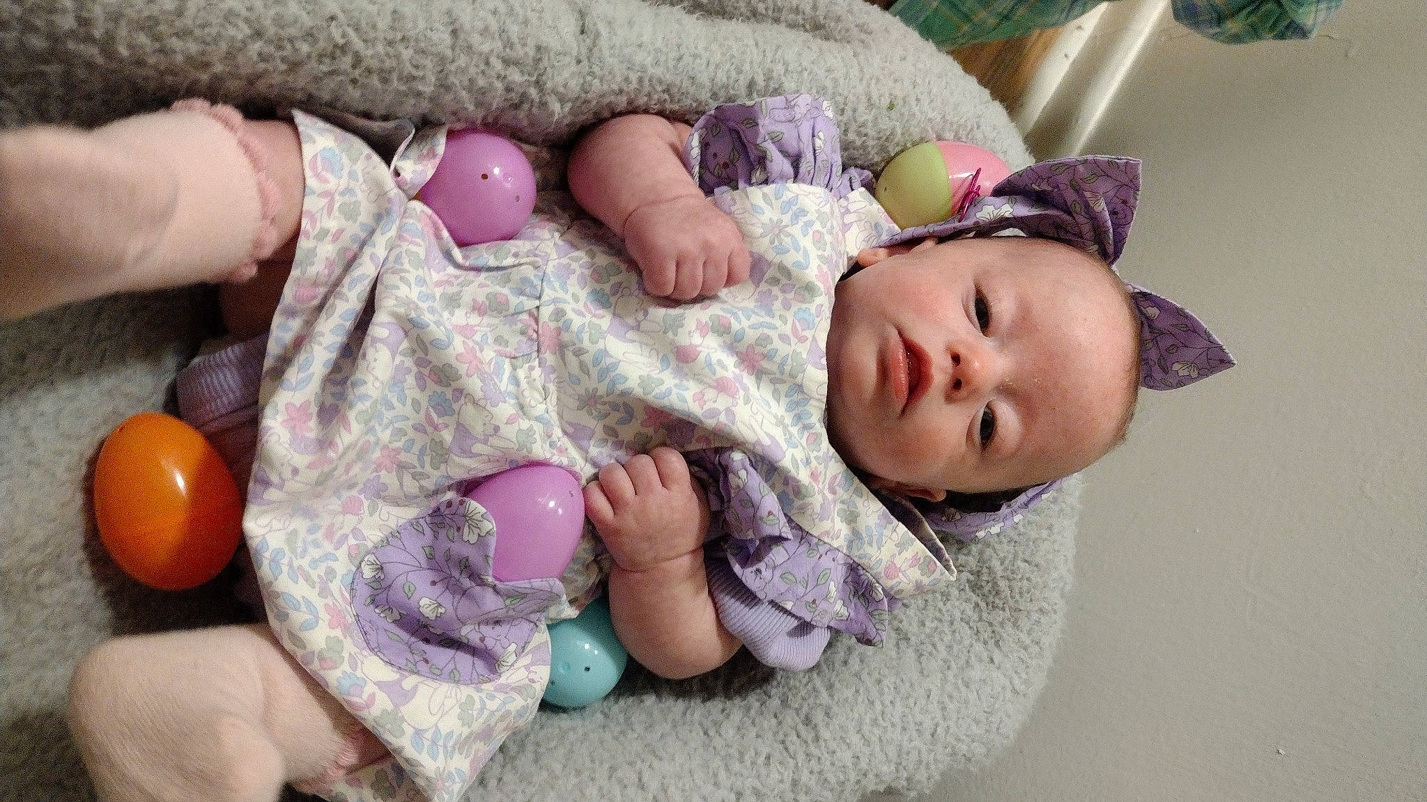 Elizabeth is registered to the contest to win money with this photo: baby, baby_products, baby_sleeping, baby_toddler_clothing, barefoot, cheek, child, comfort, foot, fur, linens, nail, pattern, person, pink, purple, skin, textile, thumb, toddler