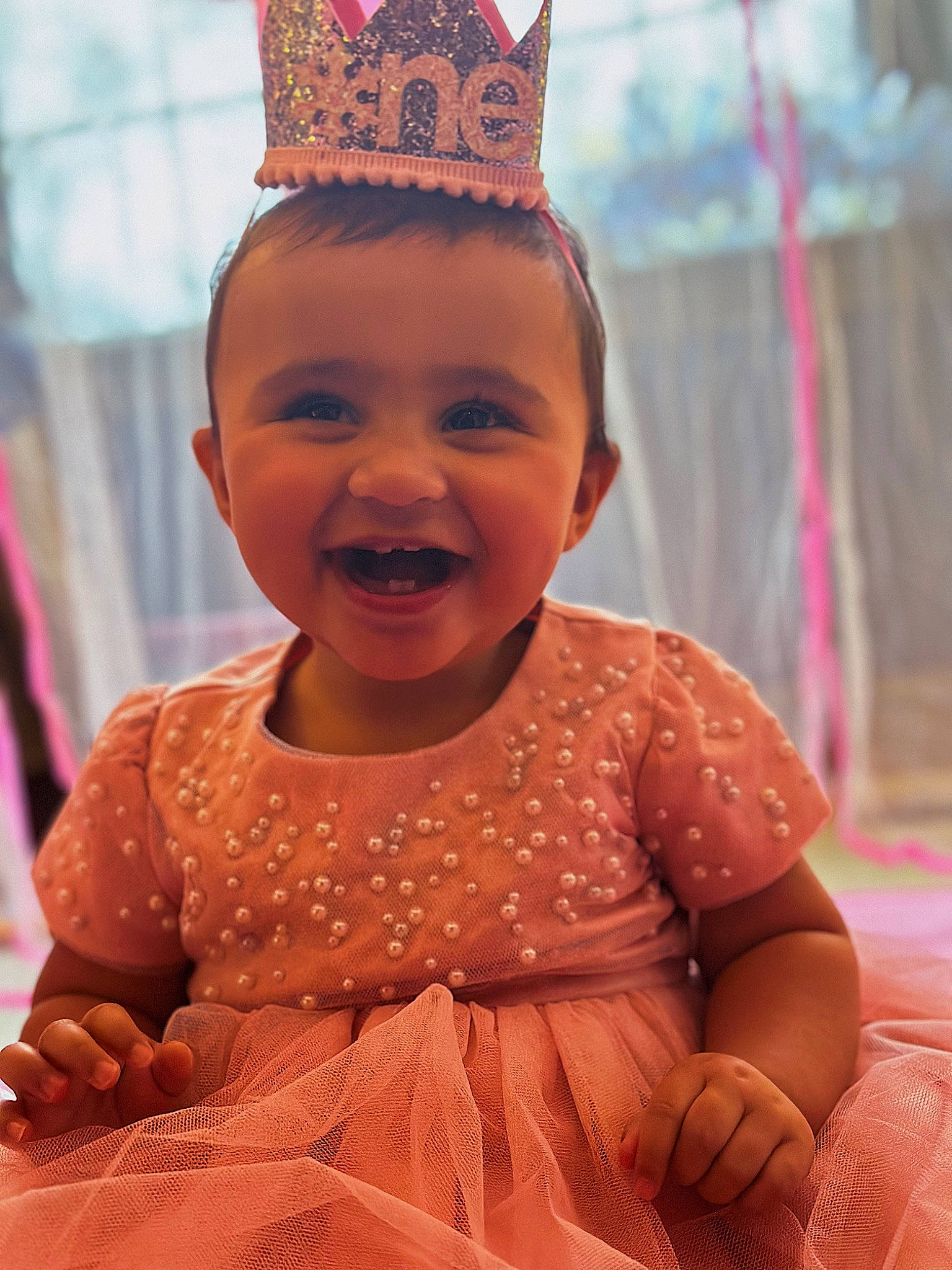 Sadie is registered to the contest to win money with this photo: baby_toddler_clothing, beauty, child, chin, dress, event, face, facial_expression, fashion, fun, hairstyle, happy, headgear, human_body, joy, organ, person, pink, skin, smile