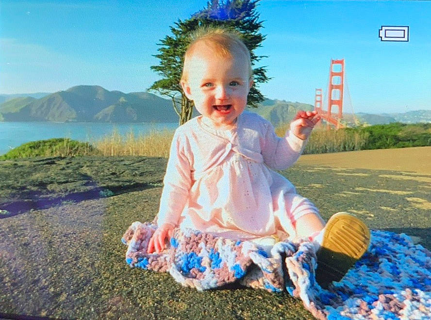 Annabeth joined the competition — help win amazing prizes! baby, child, fashion_accessory, fun, grass, happy, joy, leisure, person, photograph, photography, play, portrait_photography, sea, sitting, sky, smile, summer, toddler, travel