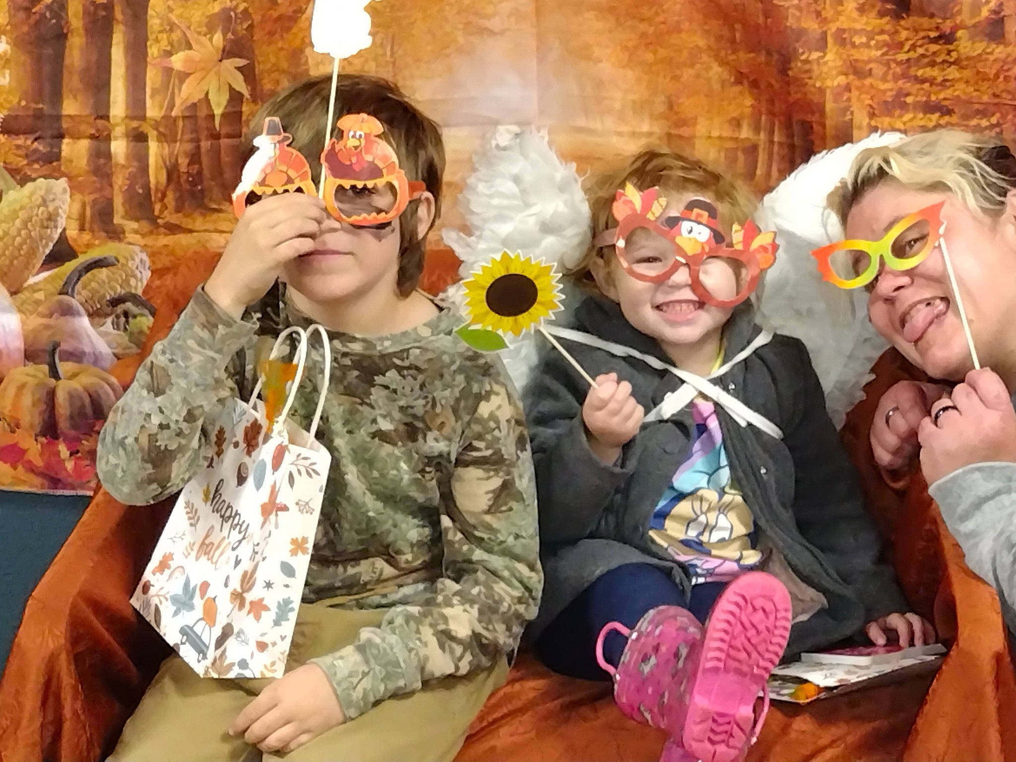 James is registered to the contest to win money with this photo: child, costume, event, eyewear, fashion, fun, happy, jewellery, leisure, mask, necklace, party, person, personal_protective_equipment, room, sitting, smile, tradition, vacation, vision_care