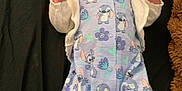 Adalynne joined the competition — help win amazing prizes! baby, infant, onesie, cartoon_pattern, socks, blanket, teddy_bear, lying_down, curious_expression, indoor, child, cute, soft_toy, colorful_clothing, small_hands, head, face, blue_onesie, pink_socks, playful