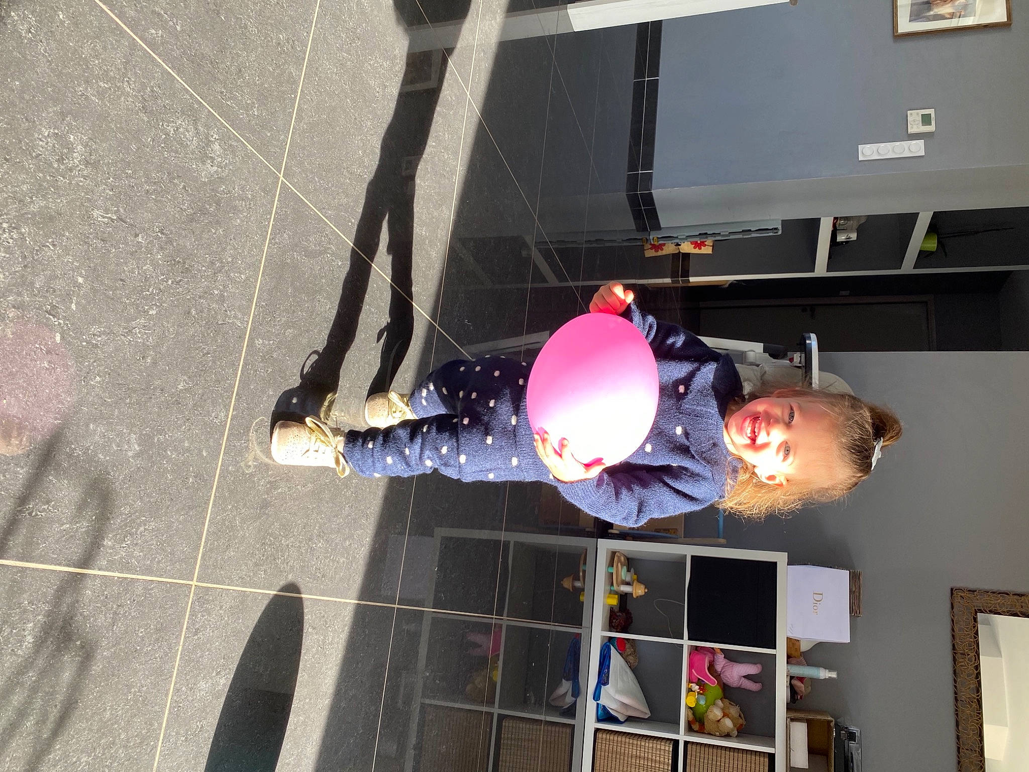 Juliette participe au concours pour gagner de l'argent avec cette photo : asphalt, concrete, fun, helmet, joy, leisure, machine, magenta, person, picture_frame, recreation, road_surface, shadow, space, toy, wall